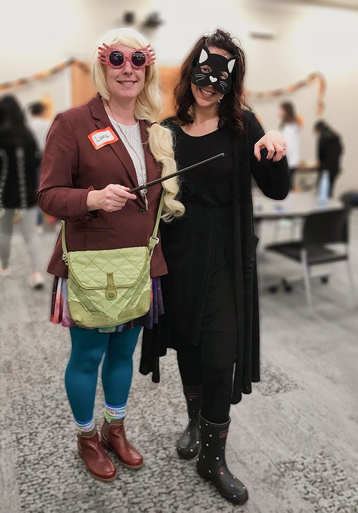 two people in costumes in a classroom